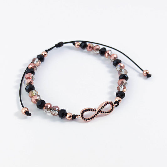 Bracelet Unlimited Sign avec perles noires et or rose